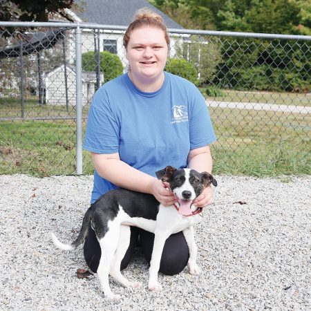 Olivia Staff Photo Animal caregiver Olivia Westover sits with puppy Maddie at the Conway Area Humane Society on Thursday morning. (RACHEL SHARPLES PHOTO)